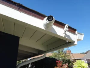 Security camera installed on house corner monitoring backyard in La Habra CA