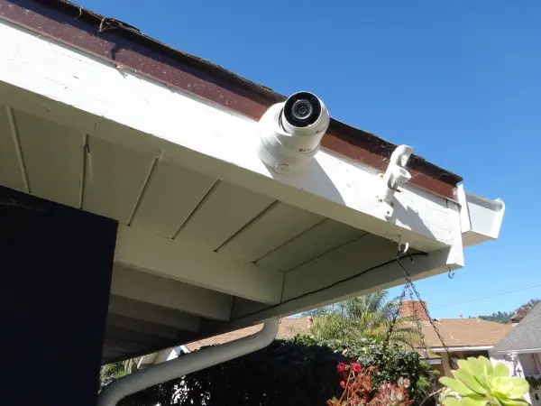 Security camera installed on house corner monitoring backyard in La Habra CA