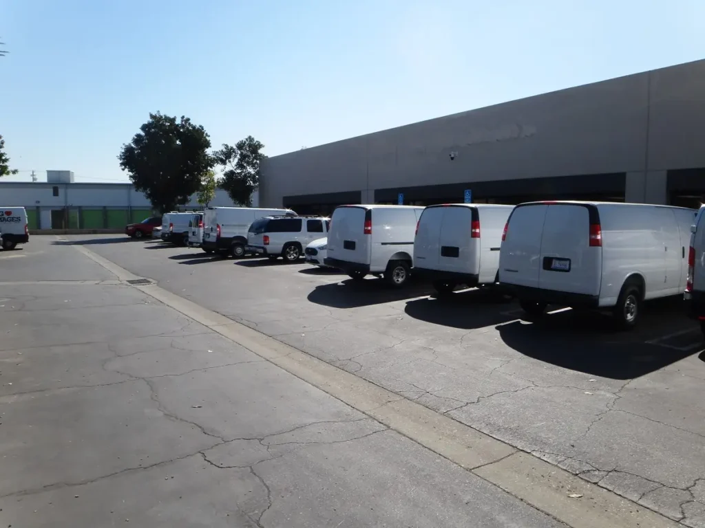 Commercial parking lot monitored by security camera system for vehicle protection and surveillance