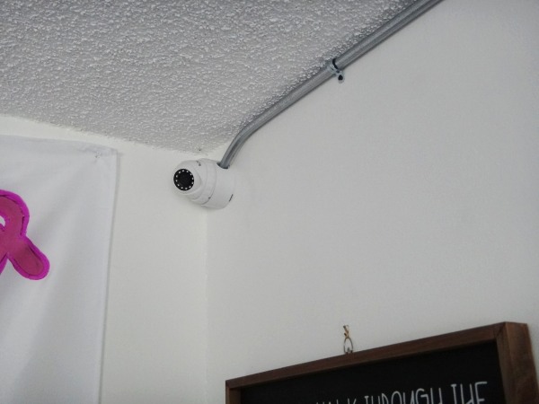 Security camera installation in Cerritos office area with conduit piping for protected wiring
