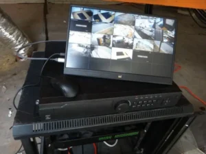 testing security camera system on DVR monitor during installation