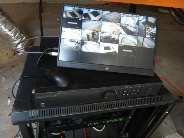 testing security camera system on DVR monitor during installation