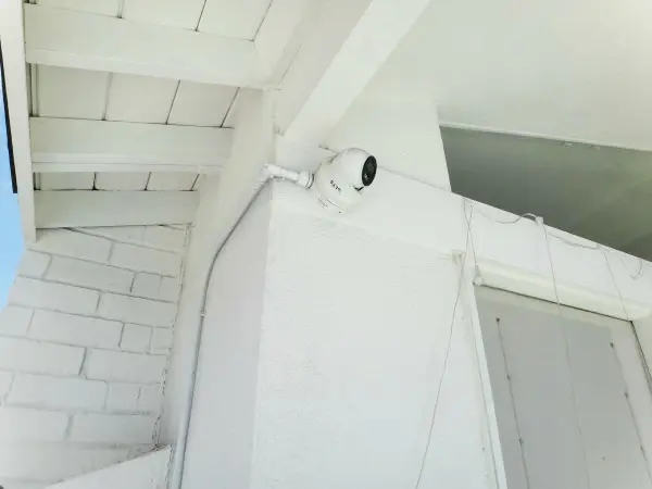 Back yard security camera installation showing piping residential surveillance camera in La Habra CA