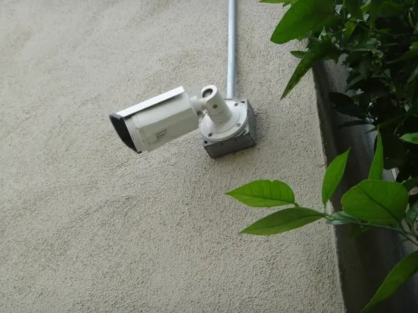Outdoor security camera before lens cleaning and maintenance service