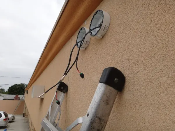 Security camera wiring and junction box preparation during commercial installation in Buena Park CA