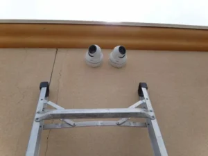Completed commercial security camera installation with dual cameras