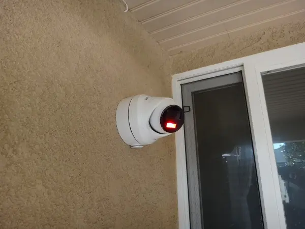Deterrence security camera with active warning light installed on residential property in Lakewood for enhanced surveillance and crime prevention.