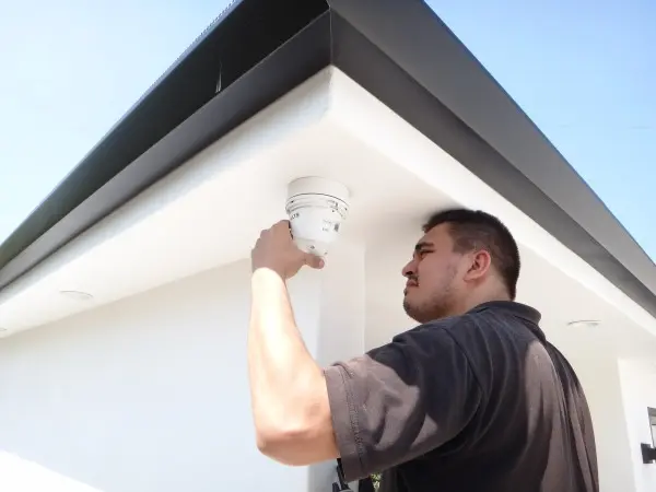 technician installing outdoor security camera under roof hacienda heights ca