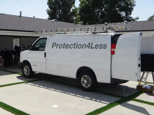 Protection4Less service van at residential security camera installation job in Rosemead CA