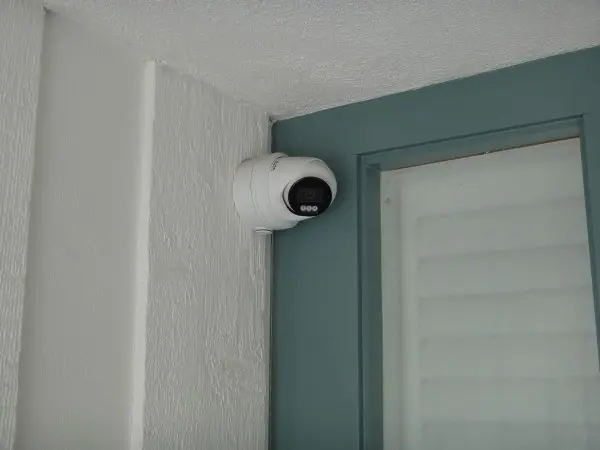 Two-way audio security camera installed at front entrance during residential