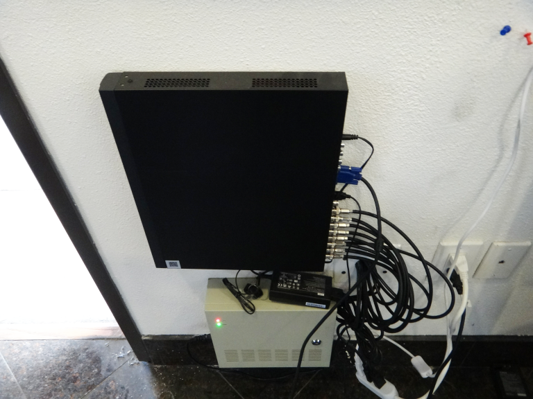 Security camera DVR and power supply installation mounted on a wall during a commercial security camera installation in Commerce CA.