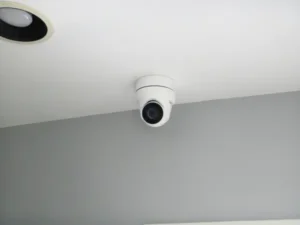 Indoor security camera mounted on a ceiling corner for residential surveillance