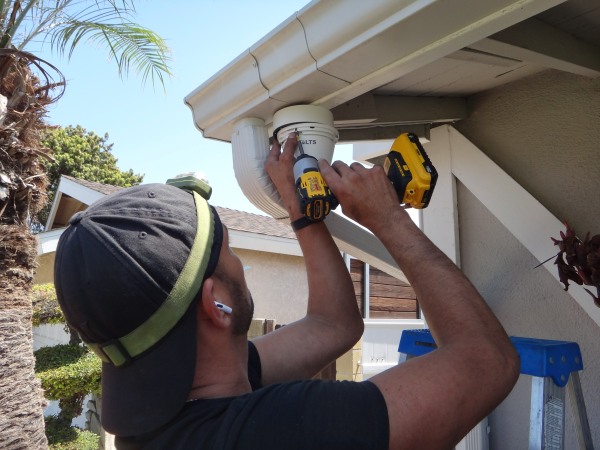 Installing a 4K security camera in the backyard of a home in Fullerton, CA