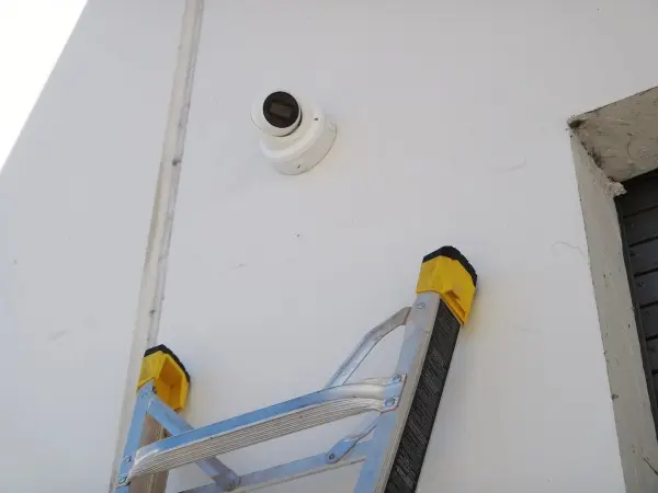 Commercial 4K security camera installed above a warehouse loading dock