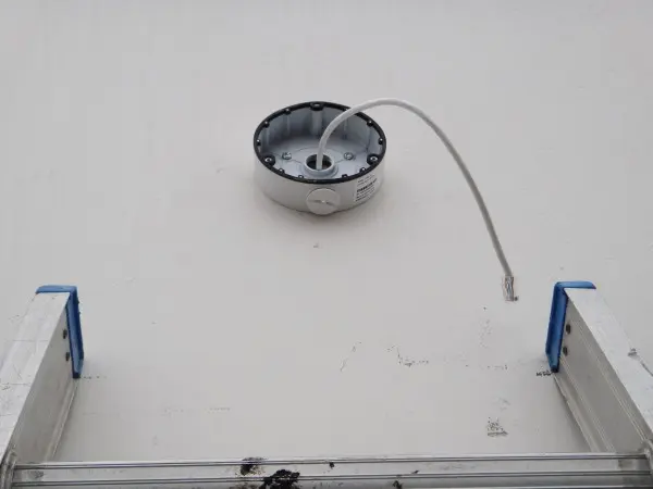 Commercial security camera junction box installed with network cable ready for camera mounting