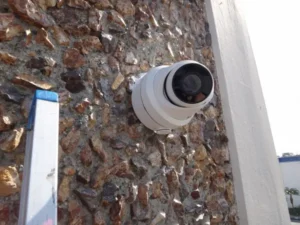 Commercial street-view security camera professionally installed on a weatherproof junction box