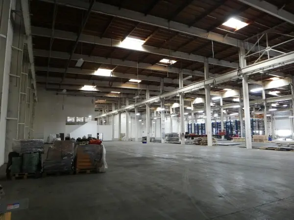 Interior of a 120,000-square-foot commercial warehouse during a security camera installation in Paramount, CA.