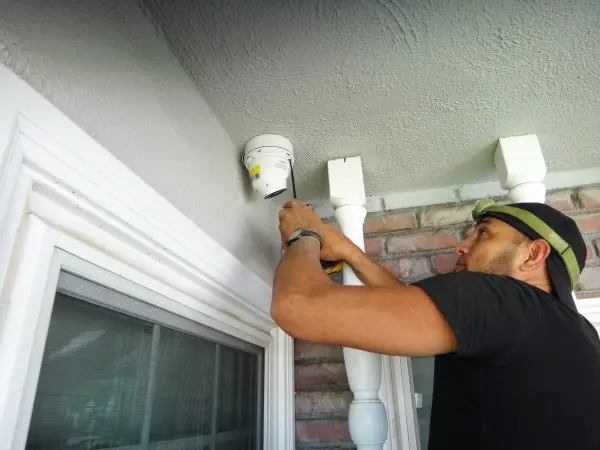 Two-way audio security camera installed at the front entrance of a home