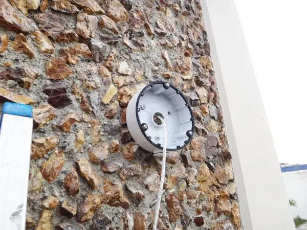 Weatherproof junction box installed for a street-view commercial security camera