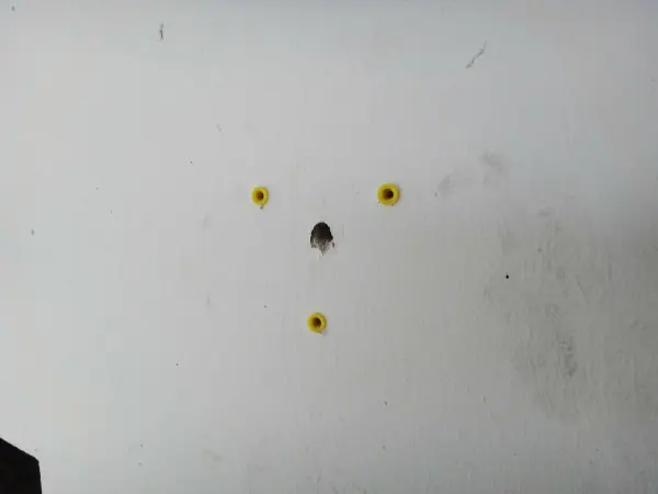 Wall anchors installed to securely mount a commercial security camera junction box