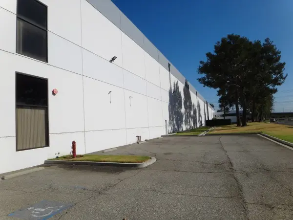 Exterior view of a commercial warehouse protected by a 14-camera security camera system in Paramount, CA.