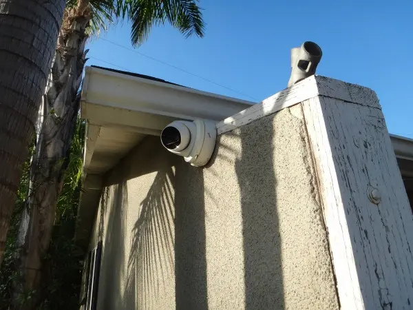 Outdoor security camera installed for residential surveillance street view