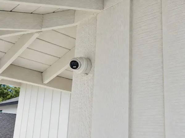 4K security camera installed on the side of a home