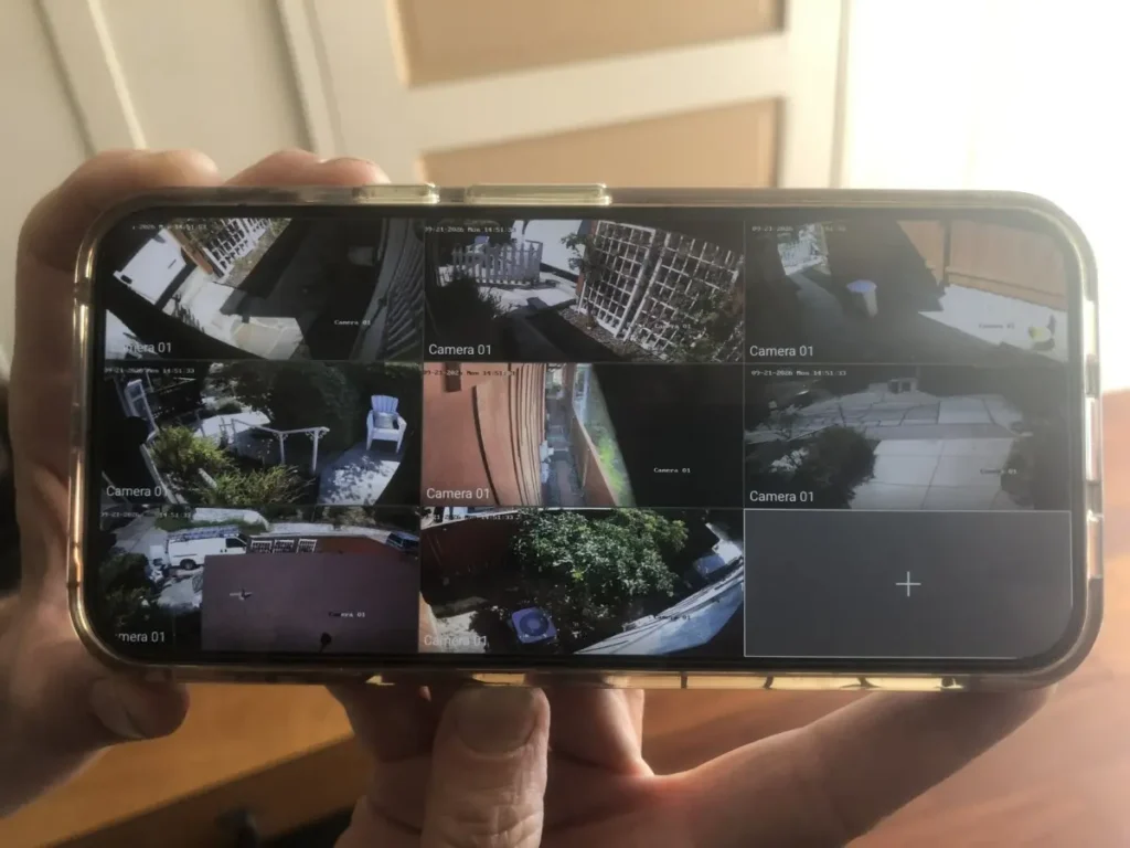 Eight security camera views displayed on a homeowner's smartphone in Whittier, CA